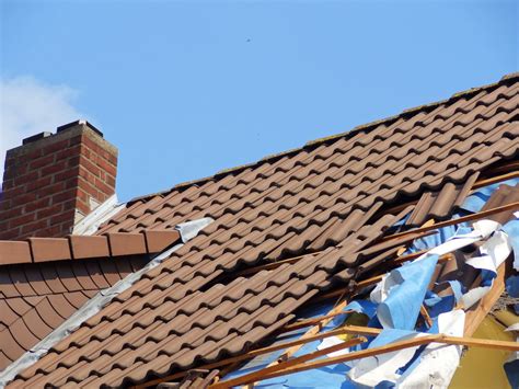 top signs  storm damage   roof landmark roofing