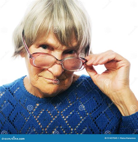 old senior lady looking through her eyeglasses royalty free stock
