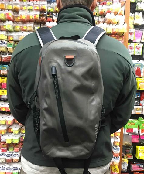 sold simms waterproof backpack great shape    cast hook   sinker