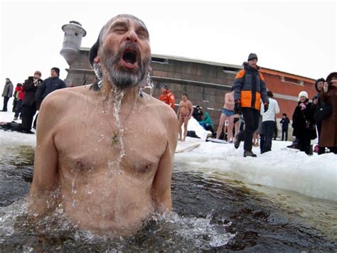 russians celebrate epiphany by diving into freezing waters