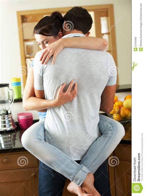 Romantic Couple Hugging In Kitchen Stock Image Image Of Sitting