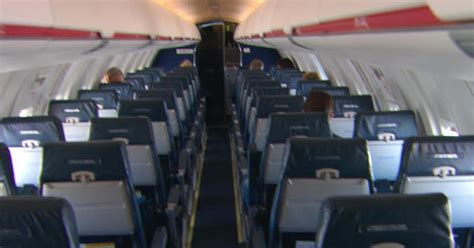 redesign  reconfigure airplane seats  larger passengers cbs news