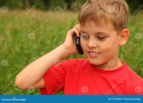 boy talking  cell phone outdoors stock photo image  green happy