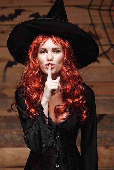 halloween witch concept happy halloween red hair witch doing silence