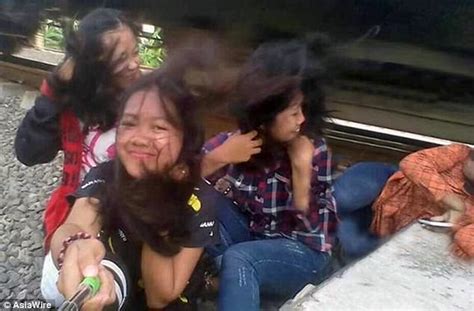 girl hit by a train in indonesia while posing for selfie daily mail