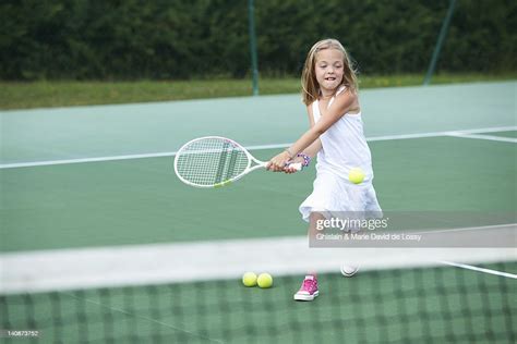 Girl Playing Tennis On Court Photo Getty Images