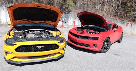 watch this chevy camaro annihilate a ford mustang in a battle of