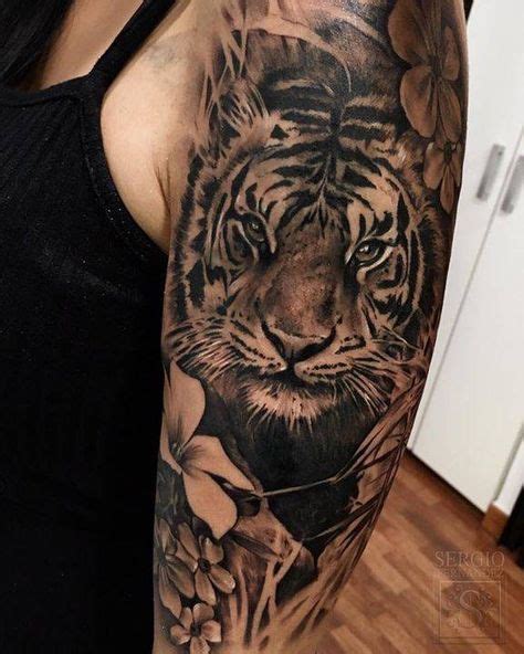 Black And Grey Tiger Tattoo On The Left Upper Arm And