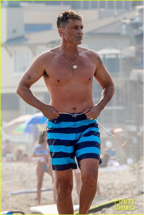 full sized photo of rob lowe shows of fit shirtless figure beach 19