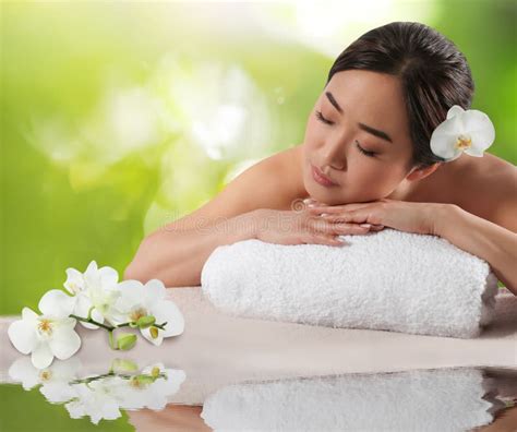 beautiful asian woman lying  massage table spa treatment stock image
