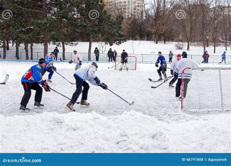 people playing amateur hockey   city ice skating rink winter playing fun snow editorial