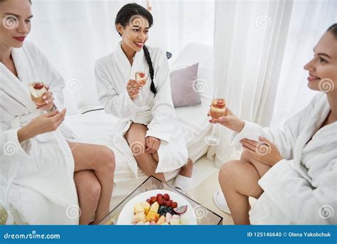 smiling girls  drinks celebrating  spa salon stock photo image