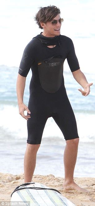 one direction s liam and louis copy the monkees as they hit the beach in australia daily mail