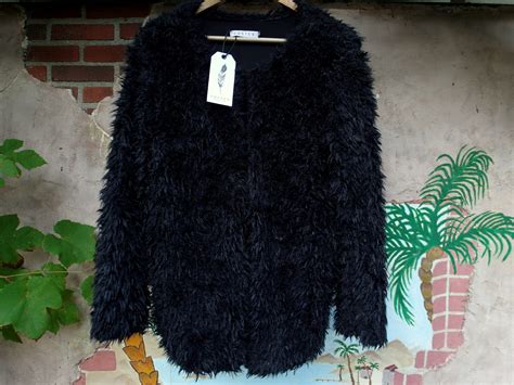 people stare   fluffy costes vest