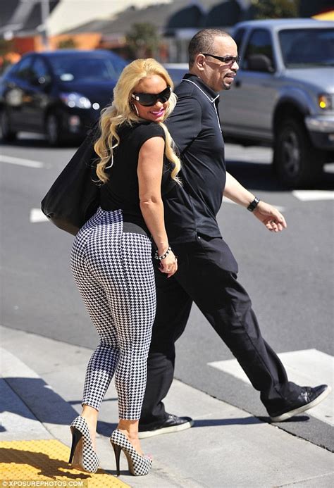 coco austin flaunts her ample assets in skintight houndstooth trousers