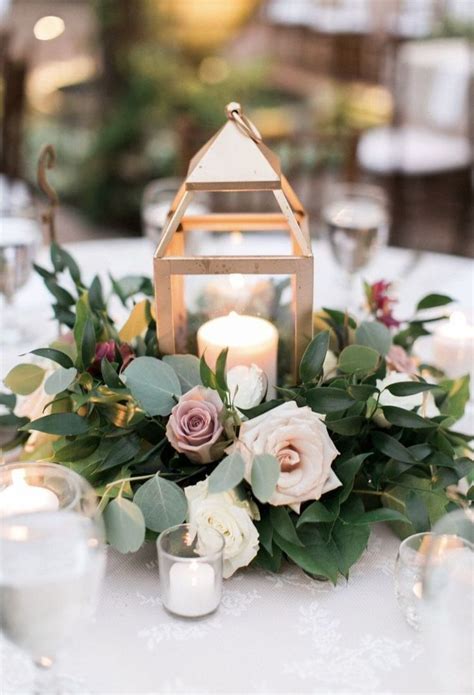 Gold Lantern Centerpiece With Ring Of Flowers And Greenery Mauve And B