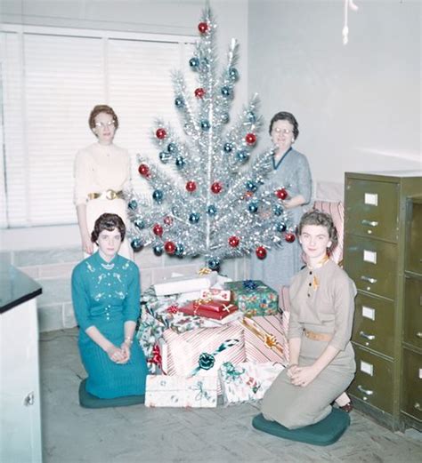 mid century women enjoying aluminum christmas trees