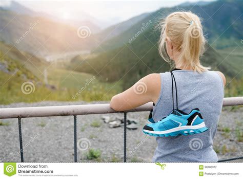 Photo Of A Woman With A Sports Shoe Over Her Shoulder