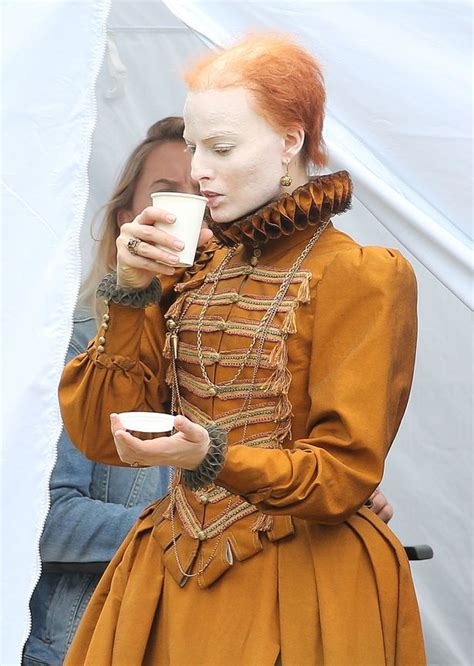 off with her hair margot robbie is unrecognisable as a pockmarked balding queen elizabeth i