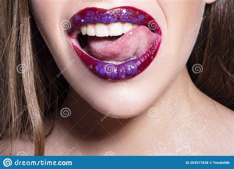 Close Up Of Open Mouth With Tongue Lick White Teeth Sensual Red Lips
