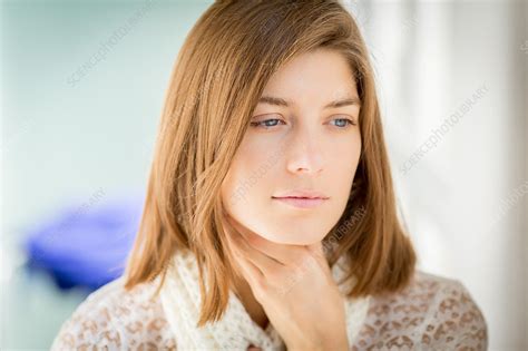 woman stroking her throat stock image c034 6520 science photo library