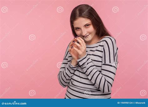 portrait  devious sneaky playful woman  striped sweatshirt