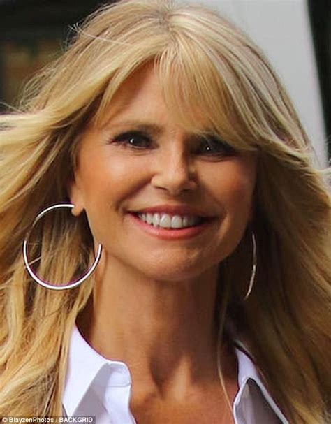 christie brinkley sexy white dress and legs out in nyc
