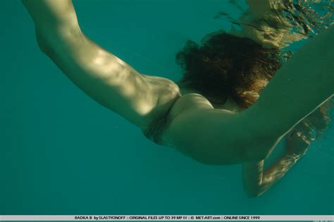 playful chick radka b spreads her legs and shows her snatch under water