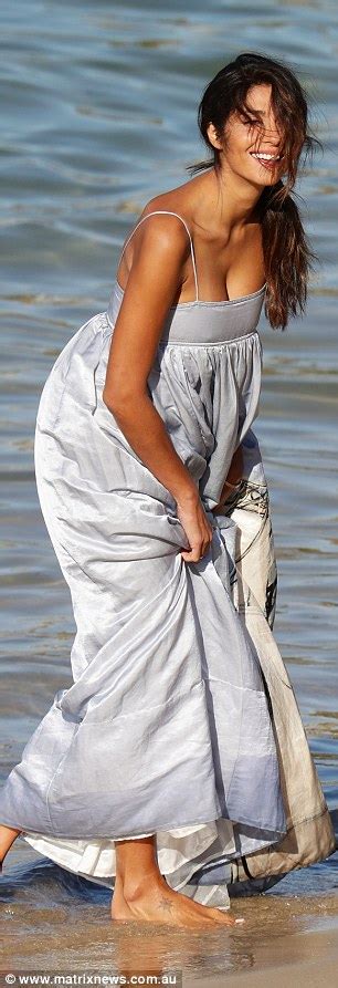 pia miller stuns in a billowing dress during a beachside photoshoot