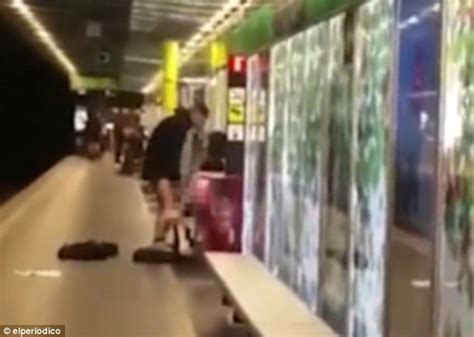 shocking moment barcelona couple have sex on the platform of a busy