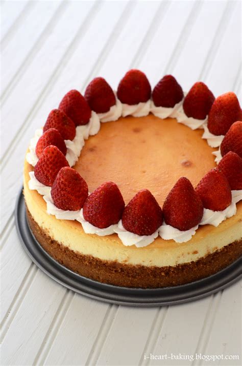 heart baking classic cheesecake decorated  whipped cream  strawberries