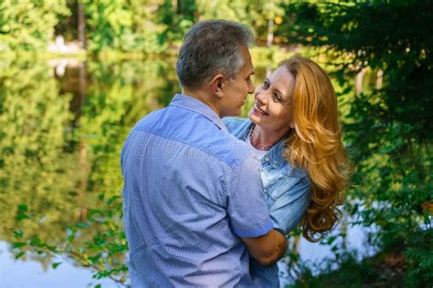 Happy Mature Couple Embracing And Embracing In Thickets Headland Near
