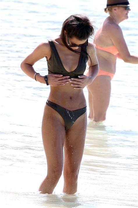 montana brown wears an olive bikini at the beach during her winter