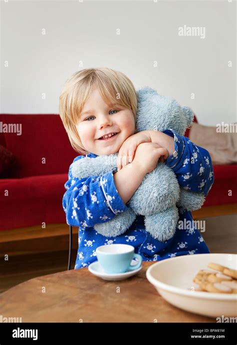 boy toddler cuddling  teddy bear stock photo alamy