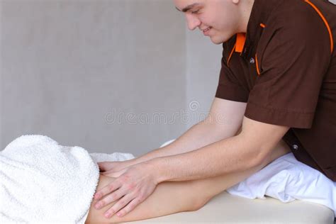 professional guy massage therapist by hand makes anti cellulite stock