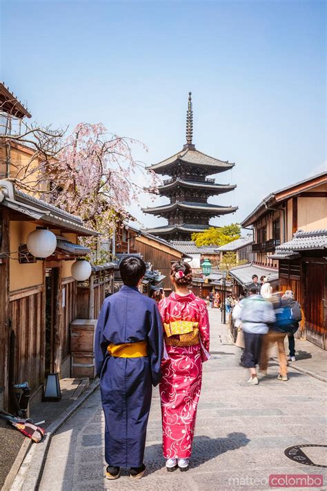 Japanese Couple Looking At Yasaka Shrine Kyoto Japan Royalty Free