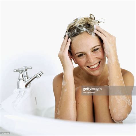 Closeup Of A Young Woman Soaping Her Hair In A Bathtub Photo Getty Images