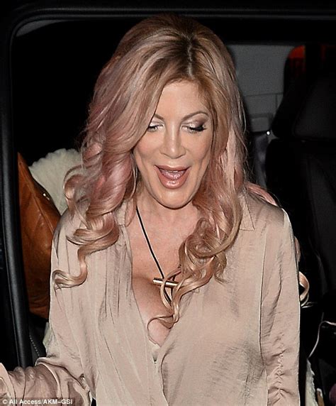 tori spelling puts on busty display in nude dress at west hollywood s