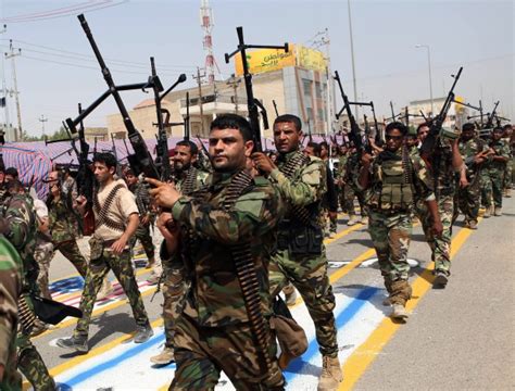 Shiite Militia Parades With Heavy Weaponry In Challenge To Sunni