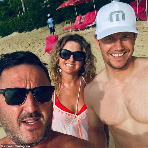 mark wahlberg shows off ripped abs as he takes bikini clad