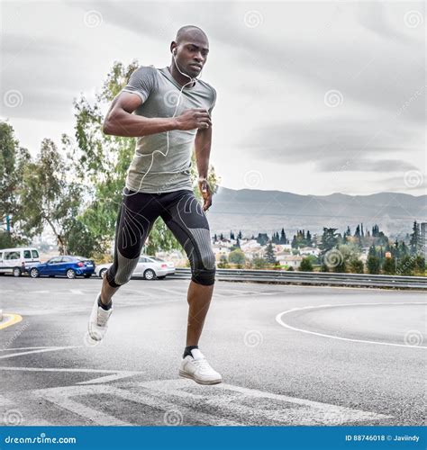 black man running outdoors  urban road stock photo image  health fitness