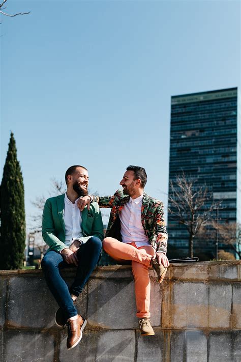 View Stylish Gay Couple Talking In Sunlight By Stocksy Contributor