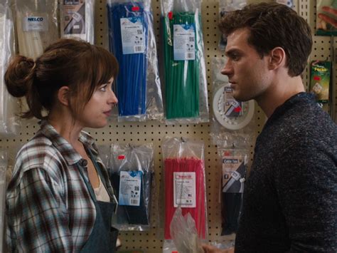 fifty shades of grey first full scene shows jamie dornan buying rope