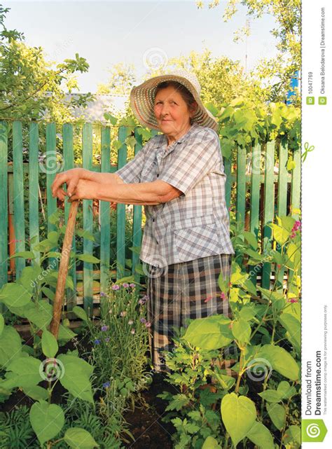 Old Woman Working In The Garden Royalty Free Stock Images