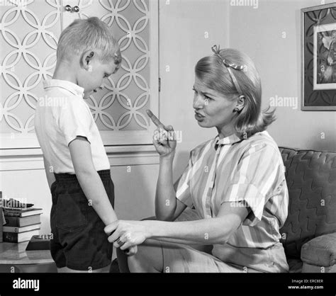 1970s Mother Disciplining Her Son By Talking Harshly And Shaking Her