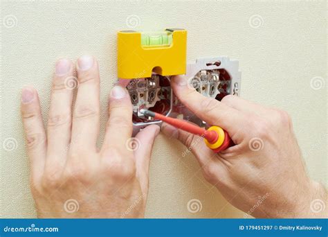 electrician service wall socket installation stock image image  screwdriver level