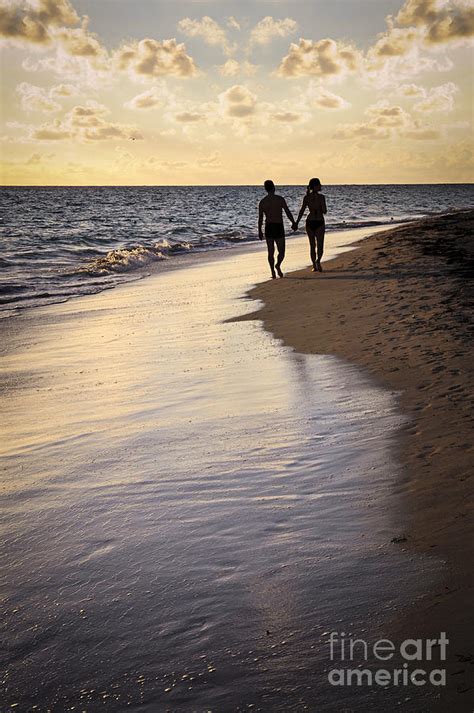 Couple Walking On A Beach Photograph By Elena Elisseeva
