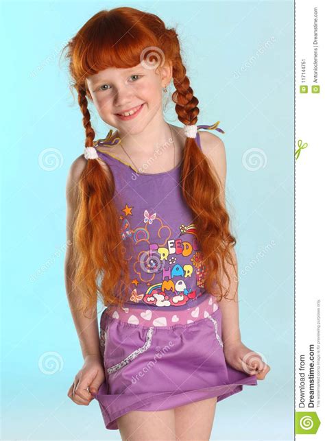 portrait of little redhead pre teen fashion girl model in