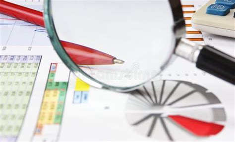 magnifying glass   working paper stock photo image  graphs