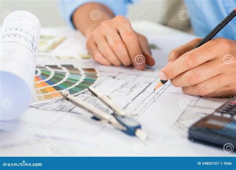 draftsman drawing blueprints royalty  stock photography image